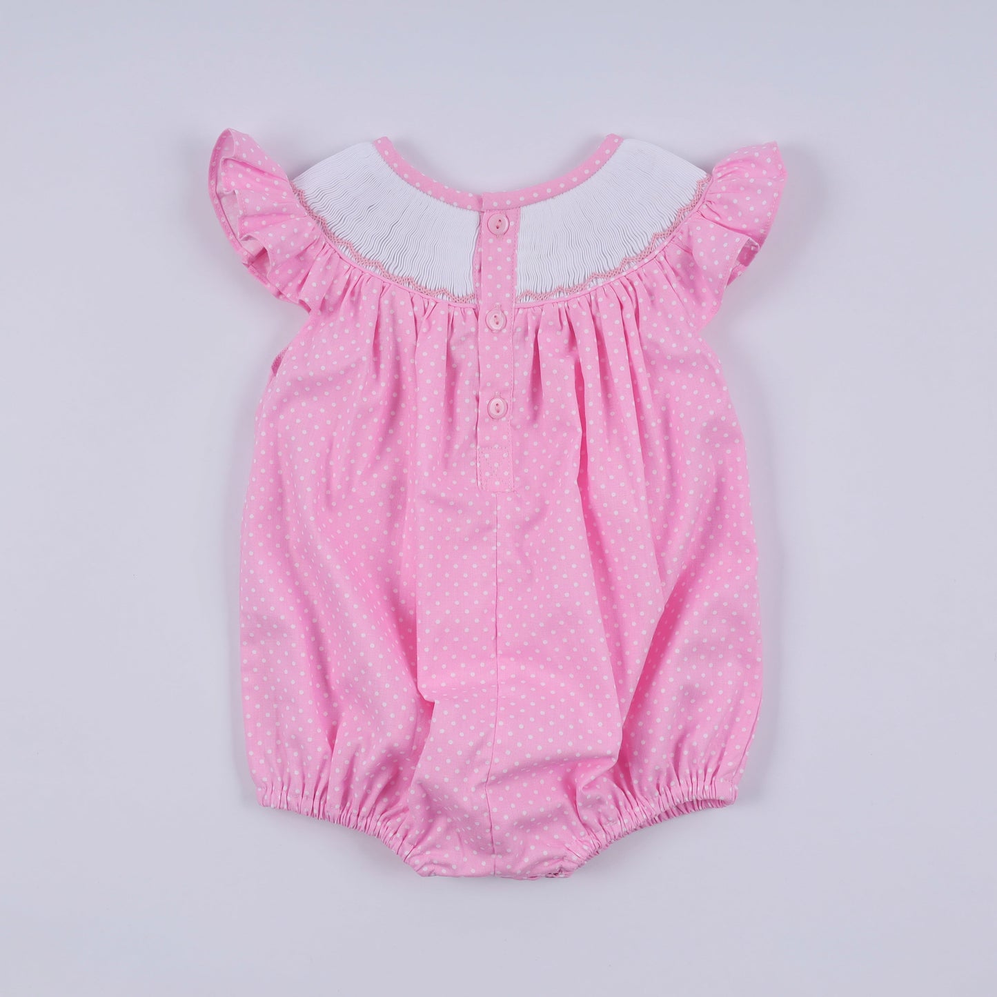 Pink character hand smocked dot ruffle bubble